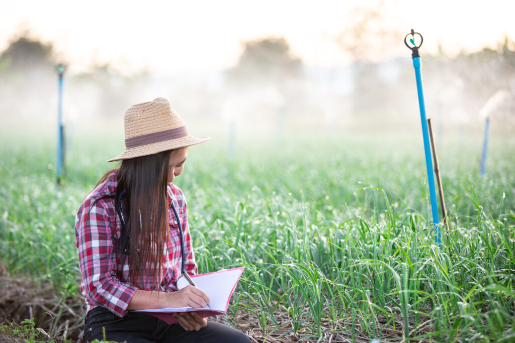 The current image has no alternative text. The file name is: farmers-smiling-women-scaled.jpg